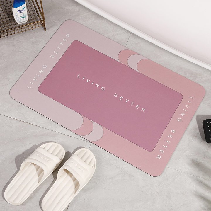 Rosa Badematte mit "Living Better" Schriftzug, rutschfest, für Badezimmer, moderne Dekoration.