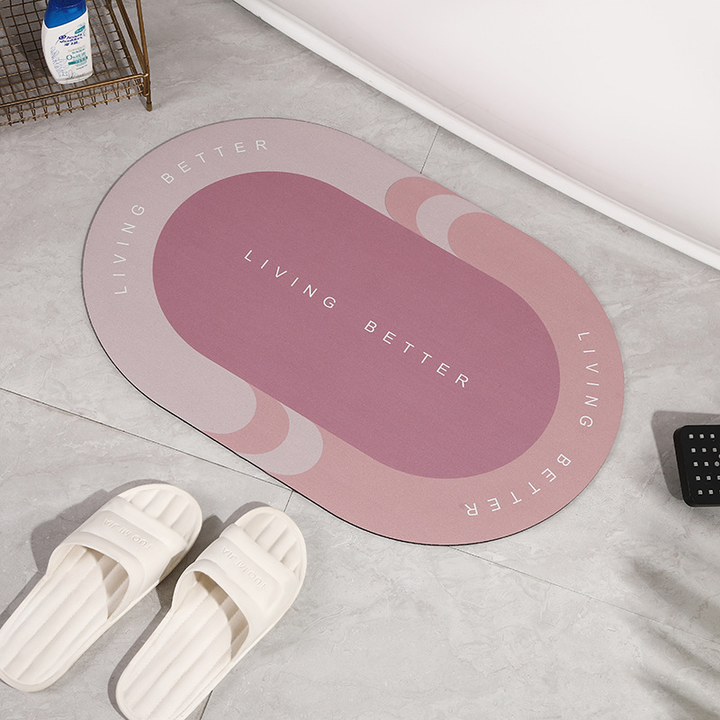 Rosa Badematte oval, rutschfest, mit "Living Better" Schriftzug, Badezimmerdekor.
