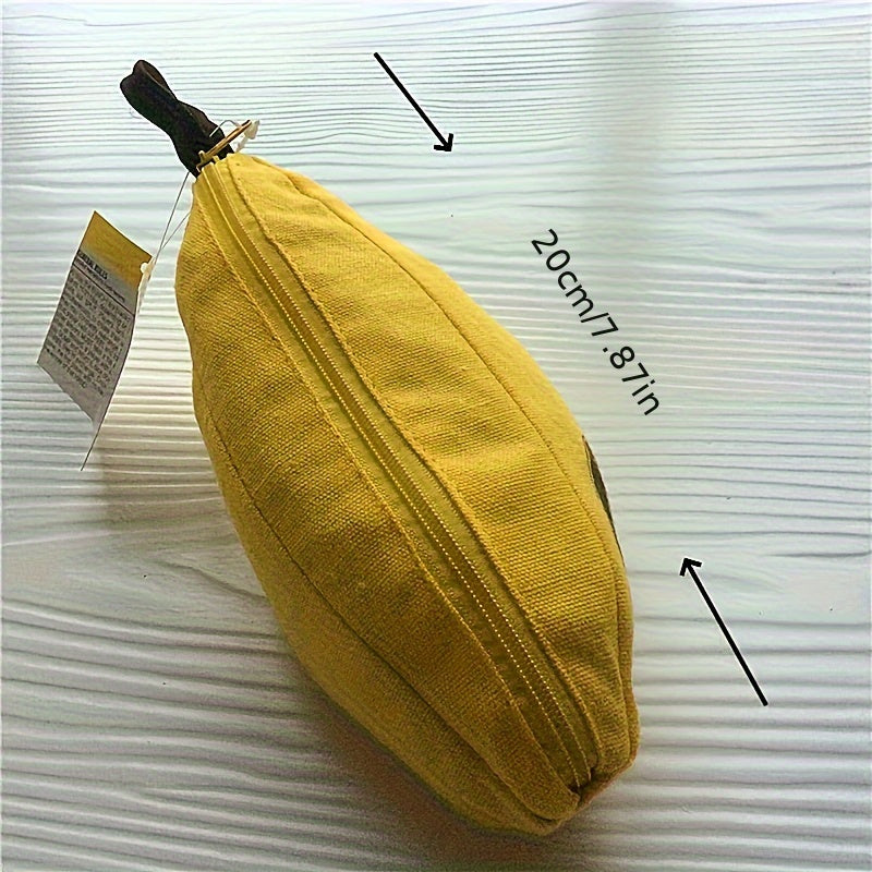 Gelbes Bananen-Etui aus Stoff, 20 cm, mit Reißverschluss, auf weißem Hintergrund.