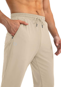 Beige Herren Jogginghose, elastisch, mit Kordelzug, seitlichen Taschen, ideal für Sport.