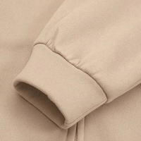 Beiger Baumwollpullover-Ärmel, geripptes Bündchen, weiches Material, modische Freizeitkleidung.