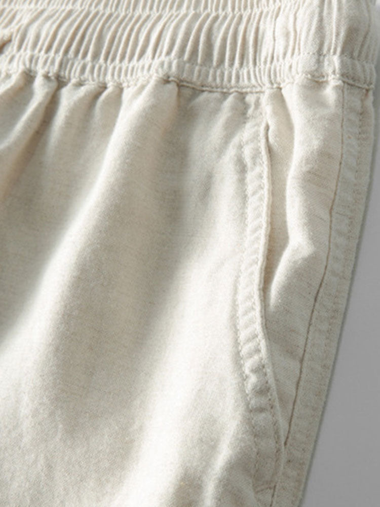Beige Jogginghose aus Baumwolle mit elastischem Bund und Seitentasche, bequeme Freizeitmode.