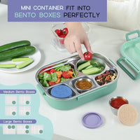 Grüne Bento-Box aus Edelstahl mit Fächern, ideal für gesunde Mahlzeiten unterwegs.