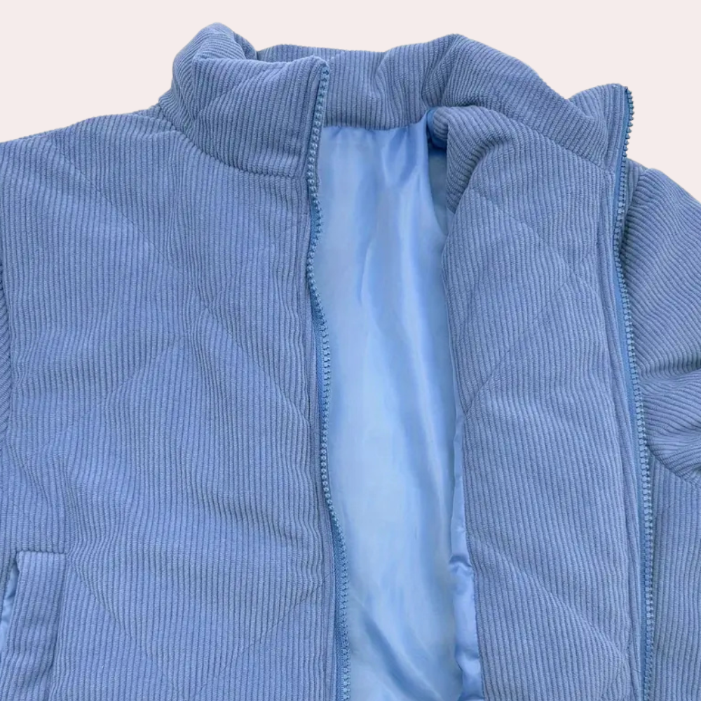 Blaue Cordjacke mit Stehkragen, Reißverschluss, wattiertem Innenfutter, modisch und warm.