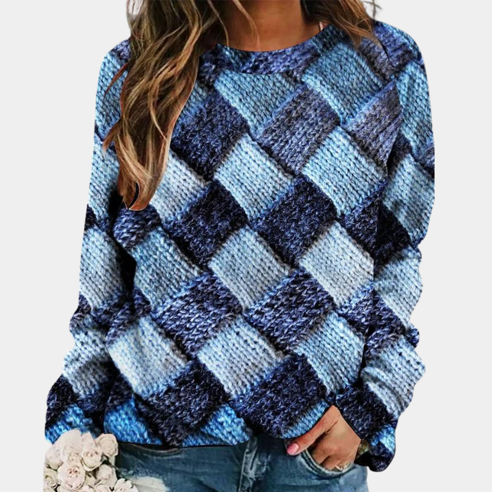 Frau in blauem Strickpullover mit Karomuster, lässiger Stil, modische Damenbekleidung.