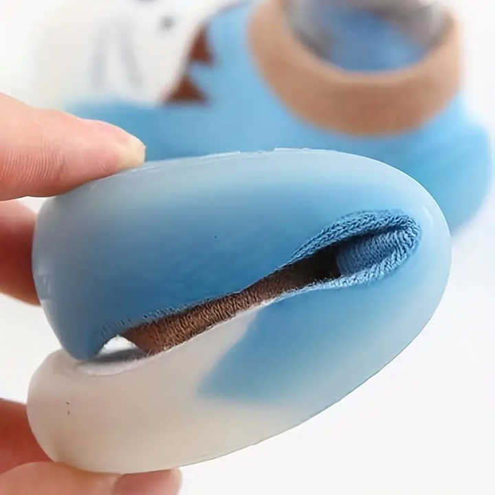 Blauer Baby-Schuh aus weichem Material, flexibel, rutschfest, ideal für Kleinkinder.