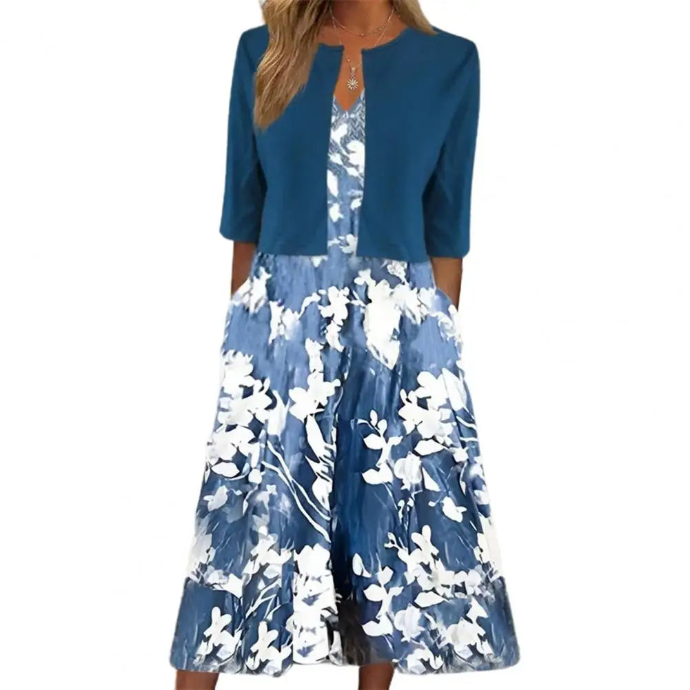 Blaues Damenkleid mit Blumenmuster, knielang, 3/4-Ärmel, elegant, Sommermode.