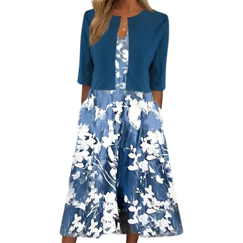 Blaues Damenkleid mit Blumenmuster, knielang, 3/4-Ärmel, elegant, Sommermode.