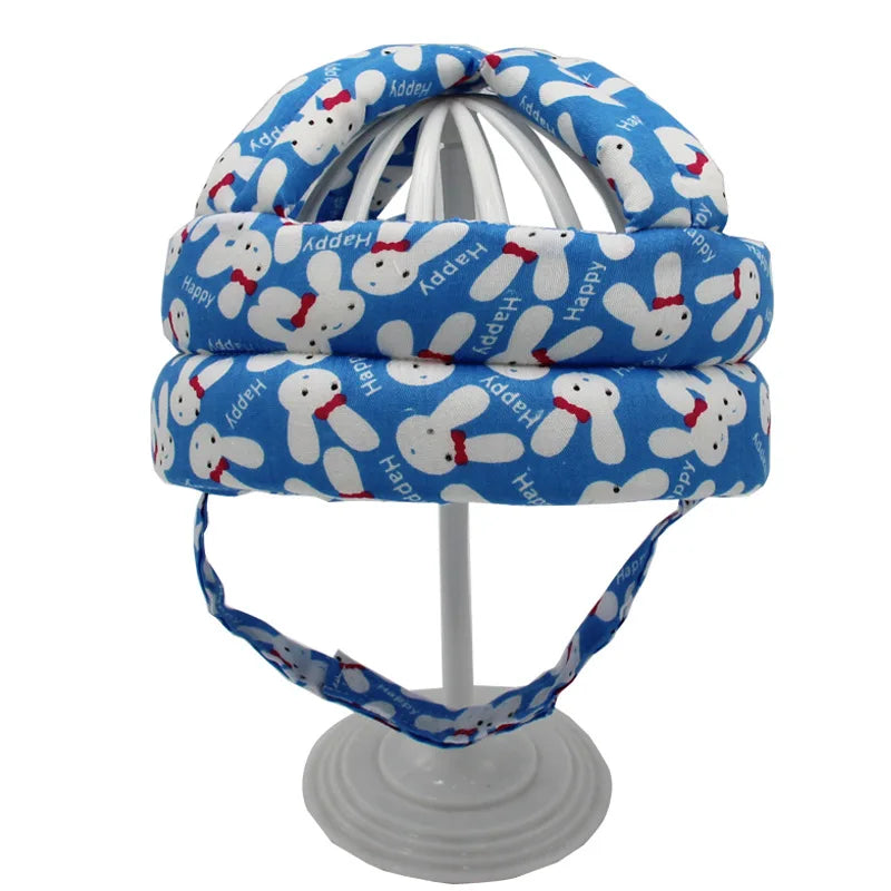 Blauer Baby-Kopfschutz mit Hasenmotiv, verstellbar, weich, sicherheitsgeprüft.