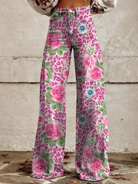 Damenhose mit Blumenmuster, rosa und grün, weites Bein, modisch, lässig, Vintage-Stil.