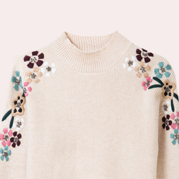 Beiger Pullover mit floralen Stickereien, Damenmode, Strick, Blumenmuster, modisch, elegant.