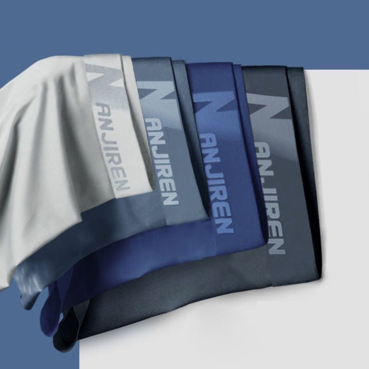 Vier Herren-Boxershorts in Blau- und Grautönen, atmungsaktiv, ultradünn, mit "ANJIREN"-Logo.