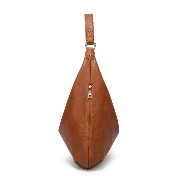 Braune Ledertasche mit Reißverschluss, modisches Accessoire, Damenhandtasche, elegant und stilvoll.