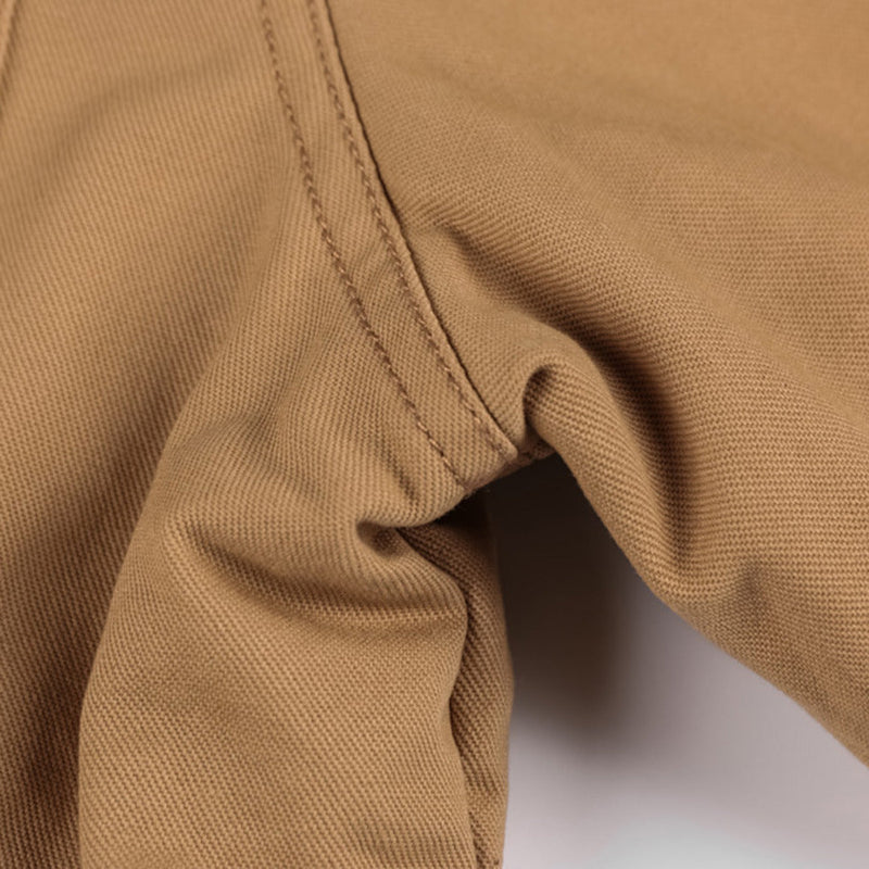 Brauner Baumwollstoff, Nahaufnahme, strapazierfähig, Textilstruktur, Nähte, Bekleidungsdesign.