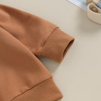 Brauner Pulloverärmel aus Baumwolle, Rippbündchen, modisch, bequem, Herbstmode.