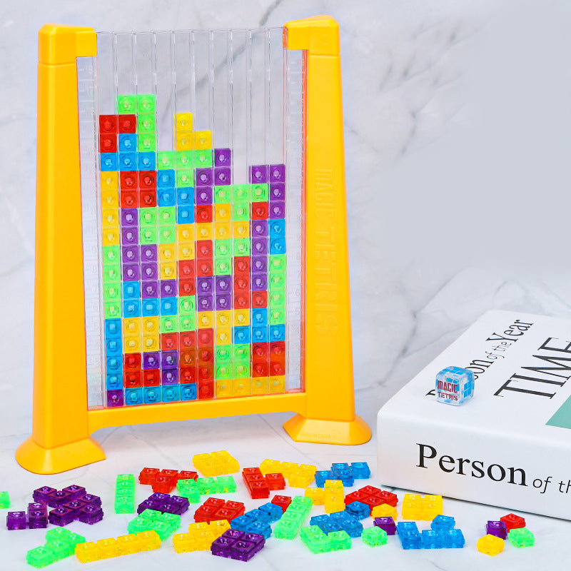 Buntes Tetris-Spielzeug aus Kunststoff, stapelbare Bausteine, gelber Rahmen, Kinderpuzzle.