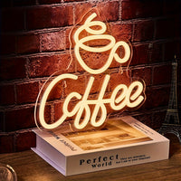 Neonlicht "Coffee" auf Buch, warmweiß, dekorative Beleuchtung, Café-Dekor, Vintage-Stil.