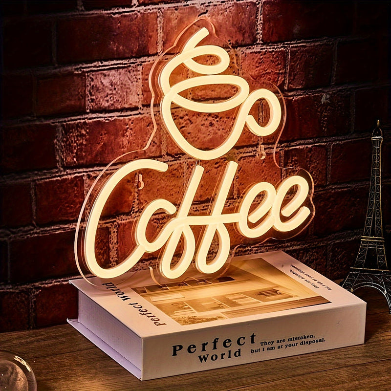Neonlicht "Coffee" auf Buch, warmweiß, dekorative Beleuchtung, Café-Dekor, Vintage-Stil.