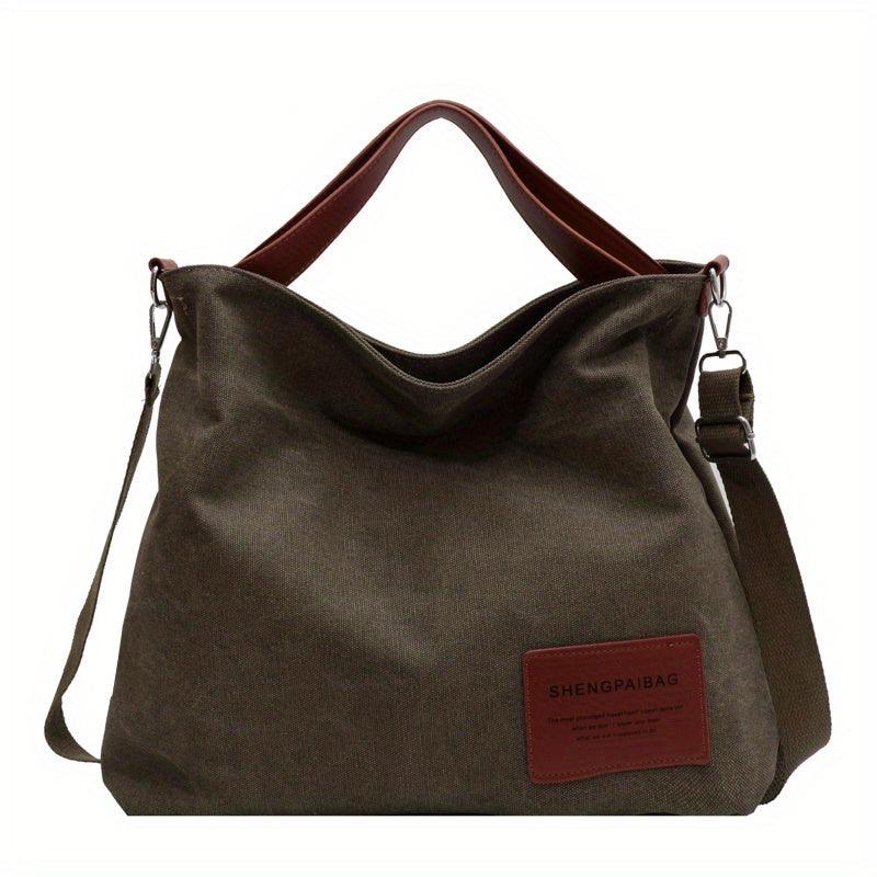 Grüne Canvas-Schultertasche mit braunen Ledergriffen, lässig, modisch, Damenhandtasche.