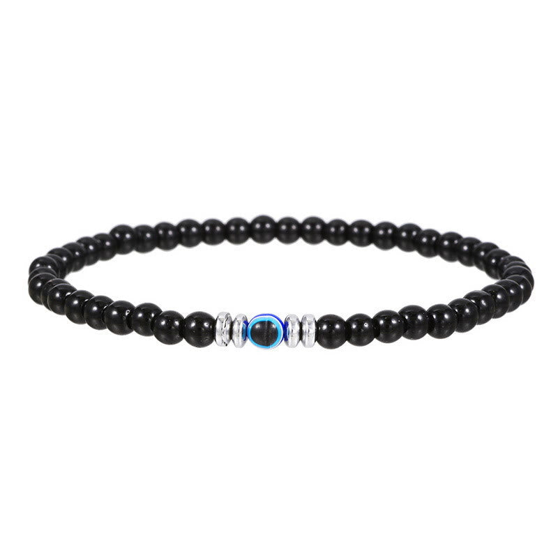 Schwarzes Perlenarmband mit blauer Perle und silbernen Akzenten, Schmuck für Herren und Damen.