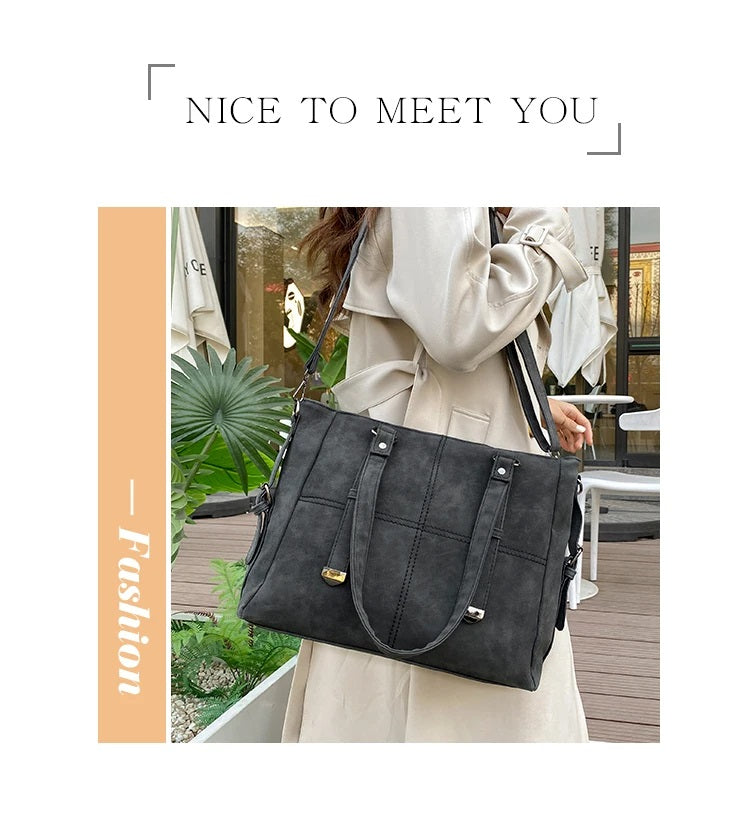 Damenhandtasche schwarz, Lederoptik, elegant, modisch, geräumig, Schulterriemen, Alltagsgebrauch.