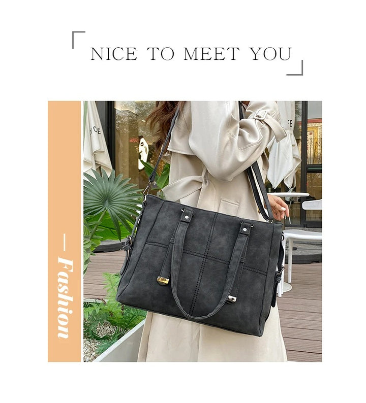 Damenhandtasche schwarz, Lederoptik, elegant, modisch, geräumig, Schulterriemen, Alltagsgebrauch.