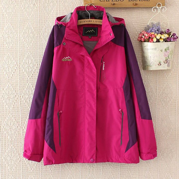 Damen Outdoorjacke pink, wasserdicht, atmungsaktiv, mit Kapuze, ideal für Wandern und Trekking.