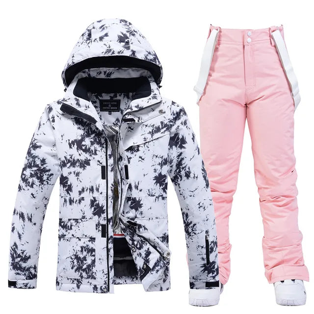 Damen Skianzug, weiß-schwarz gemusterte Jacke, rosa Hose, winddicht, wasserdicht.