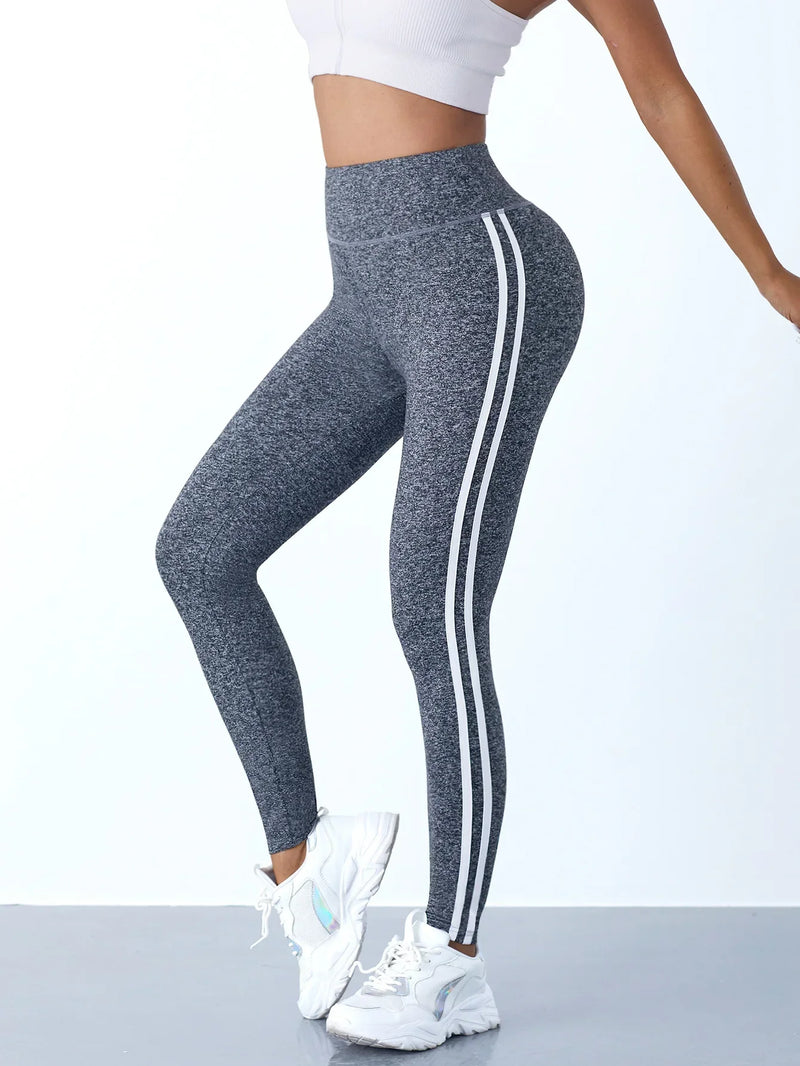 Damen Sportleggings grau mit weißen Streifen, hoch tailliert, ideal für Fitness und Yoga.
