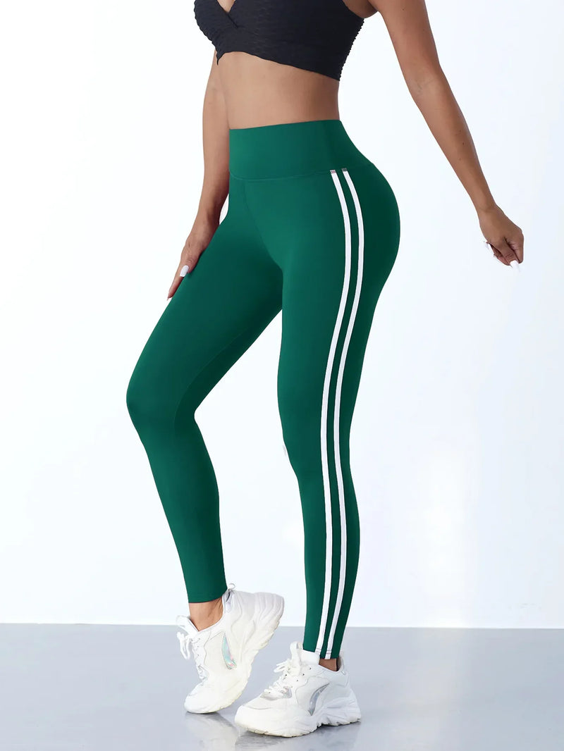 Damen Sportleggings grün mit weißen Streifen, hoch tailliert, ideal für Fitness und Yoga.
