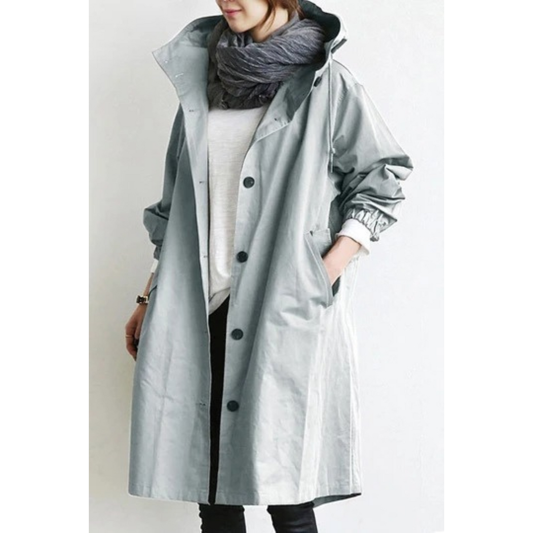 Damen-Trenchcoat grau, lang, mit Knöpfen, modisch, Herbstmode, lässig, stilvoll.