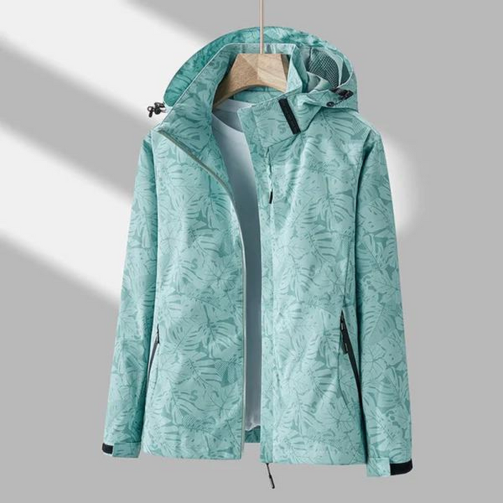 Damen Outdoorjacke, mintgrün, wasserabweisend, mit Kapuze, florales Muster, Freizeitkleidung.