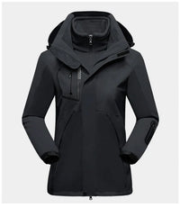 Schwarze wasserdichte Outdoor-Jacke mit Kapuze, Reißverschluss und Taschen für Damen.