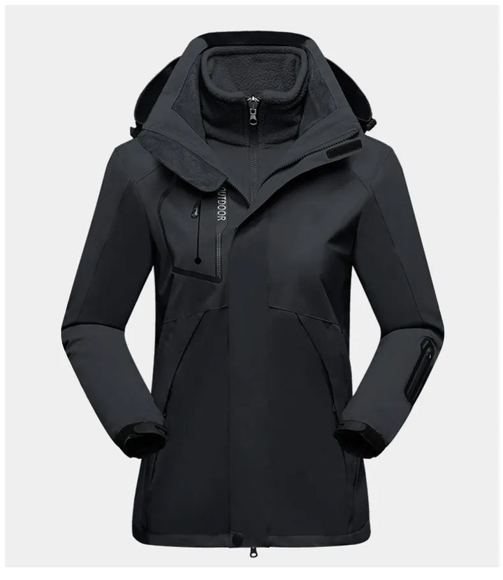 Schwarze wasserdichte Outdoor-Jacke mit Kapuze, Reißverschluss und Taschen für Damen.