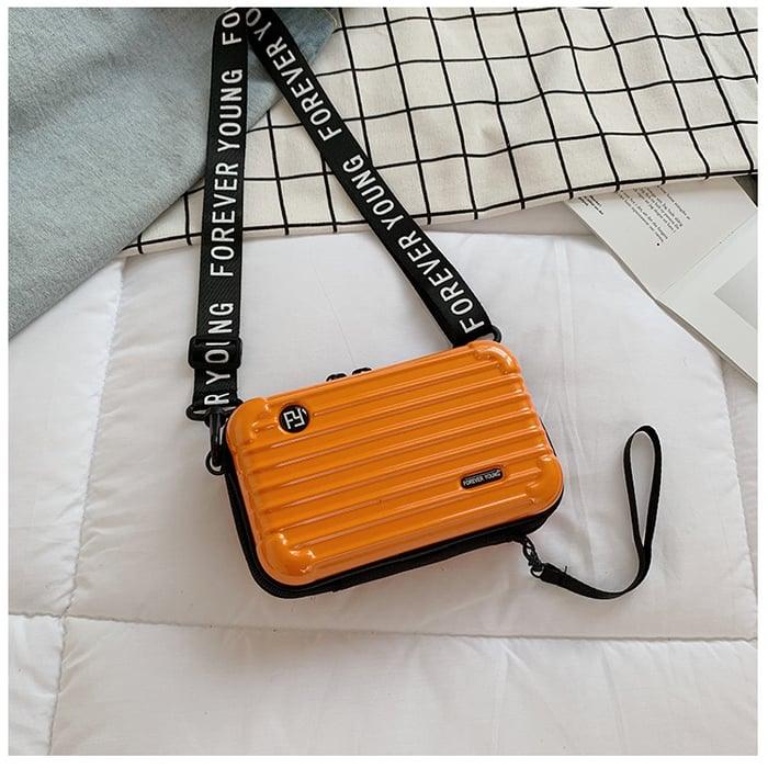 Orange Mini-Koffer-Handtasche für Damen, mit Schulterriemen, modisch, kompakt, stilvoll.