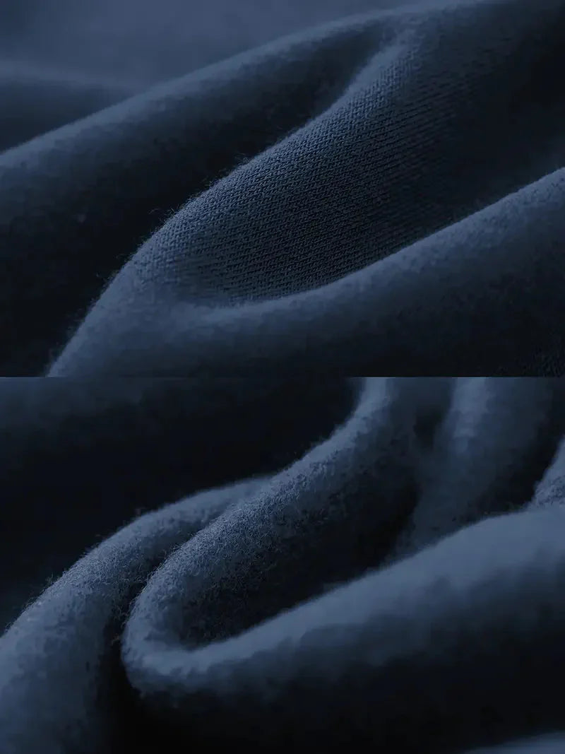 Dunkelblauer Baumwollstoff, weiche Textur, Nahaufnahme, hochwertige Bekleidungsmaterialien.