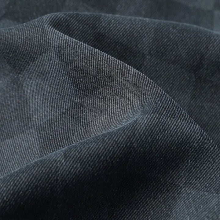 Dunkelgrauer Jeansstoff, Nahaufnahme, Textur, Baumwolle, strapazierfähig, Mode, Bekleidungsmaterial.