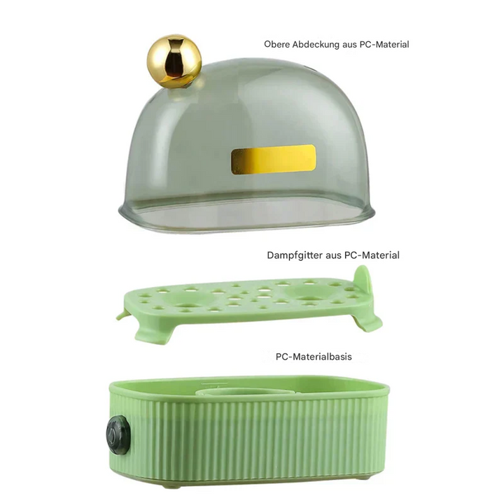 Grüner Eierkocher mit PC-Material, Dampfgitter und goldener Kugelgriff, modern und funktional.