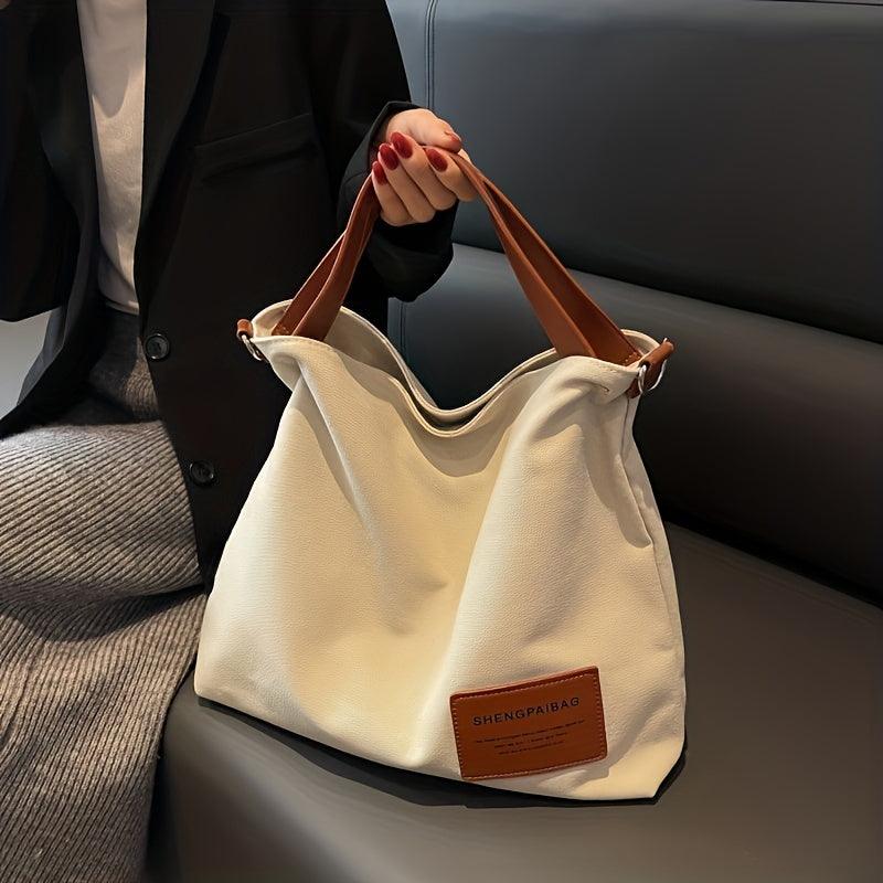 Weiße Canvas-Schultertasche mit braunen Griffen, modisch, lässig, Damen-Handtasche.