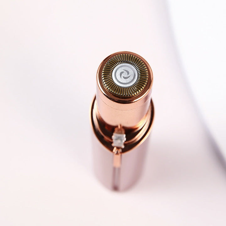 Damenrasierer in Roségold, tragbar, elektrisch, für Gesichtshaarentfernung, stilvolles Design.