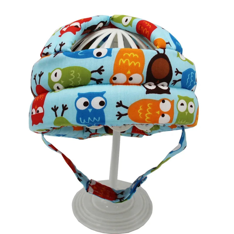Baby-Schutzhelm mit buntem Eulenmuster, verstellbar, weich, für Kleinkinder.