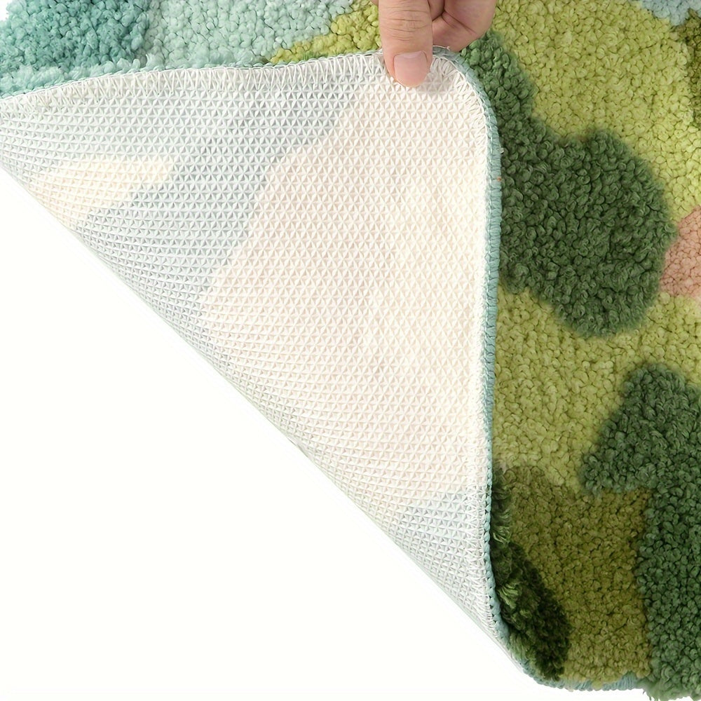 Grüner Teppich mit rutschfester Unterseite, handgefertigt, weiche Textur, modernes Design.