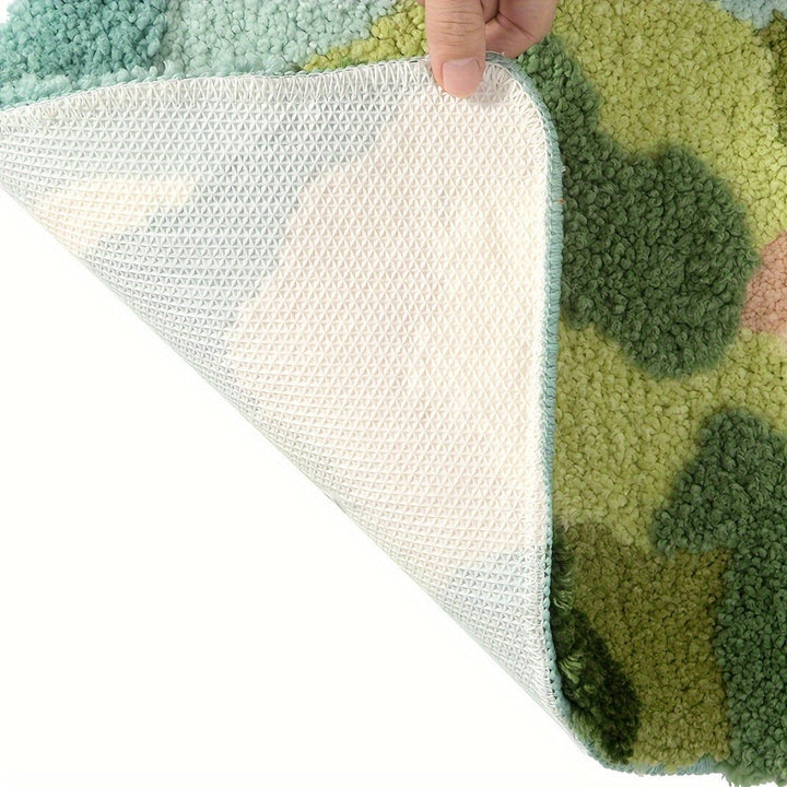 Grüner Teppich mit rutschfester Unterseite, handgefertigt, weiche Textur, modernes Design.