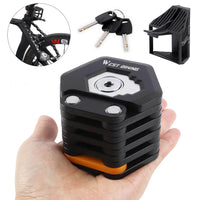 Schwarzes faltbares Fahrradschloss mit Schlüsseln, kompakt, sicher, ideal für Diebstahlschutz.