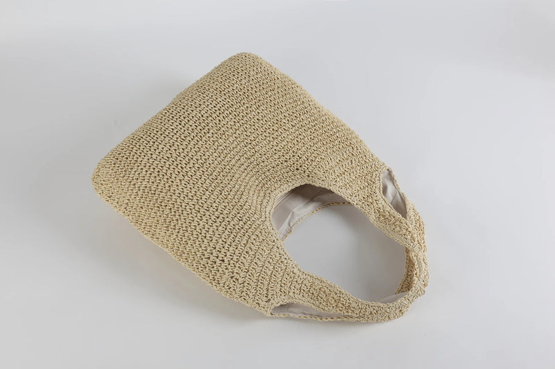 Beiger, handgefertigter Strohtasche, umweltfreundlich, modisch, ideal für Sommerausflüge.