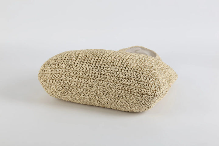 Beige handgefertigte Strohtasche, umweltfreundlich, Sommermode, Strandaccessoire.