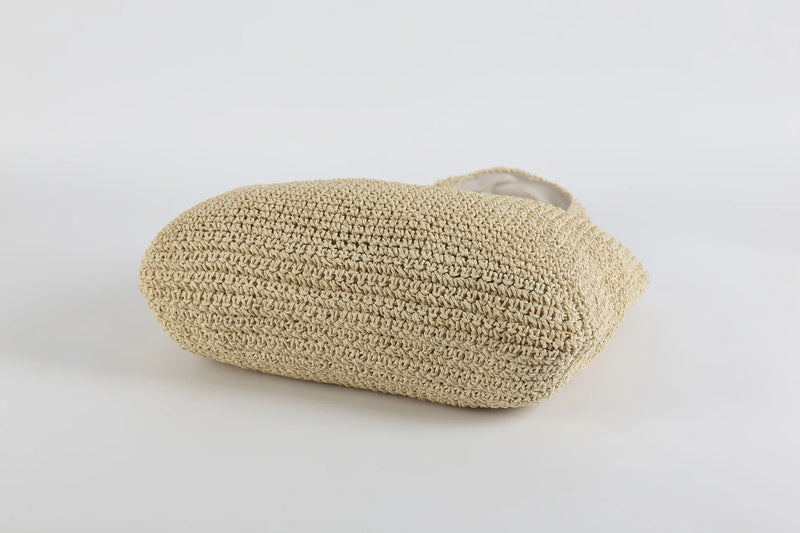 Beige handgefertigte Strohtasche, umweltfreundlich, Sommermode, Strandaccessoire.