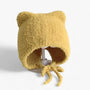 Gelbe Plüsch-Babymütze mit Bärenohren, weiches Material, ideal für kaltes Wetter.