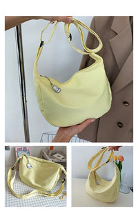 Gelbe Umhängetasche aus Stoff, lässig, modisch, mit Reißverschluss, ideal für den Alltag.