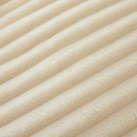 Beige gerippter Stoff, weiche Textur, ideal für Polsterung oder Heimtextilien.